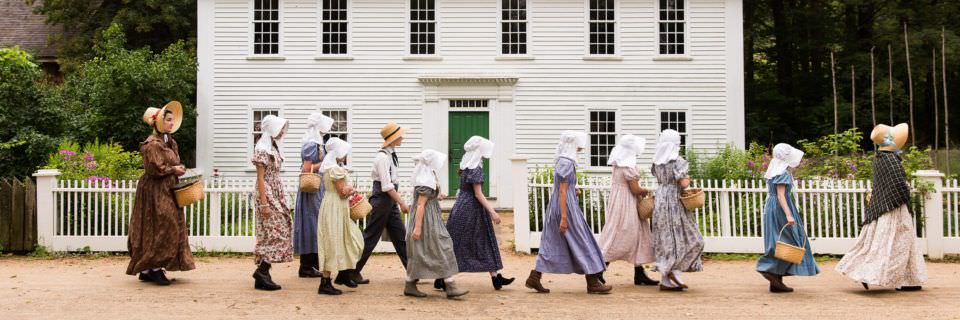 A group of young kids in early 19th-century costume