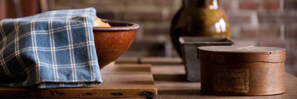 A bowl and other kitchen items sitting on a table