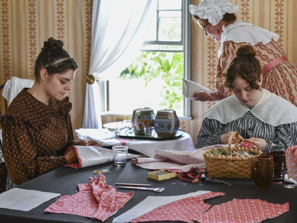Women sewing around a table