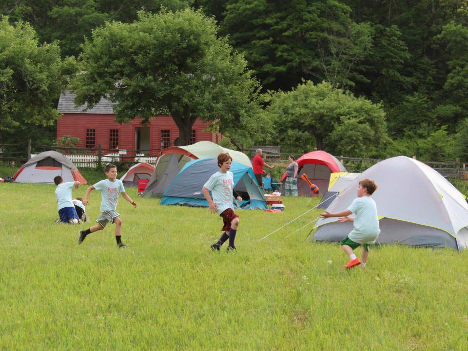 Cup scouts play in the field where their tents are set up