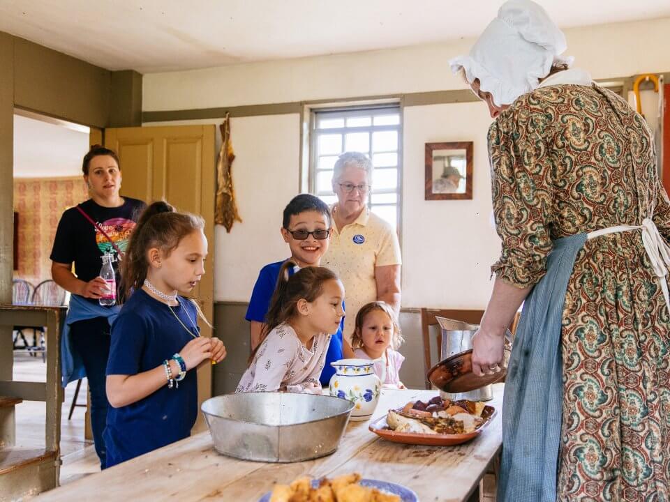 Preparing food in the Freeman Farmhouse