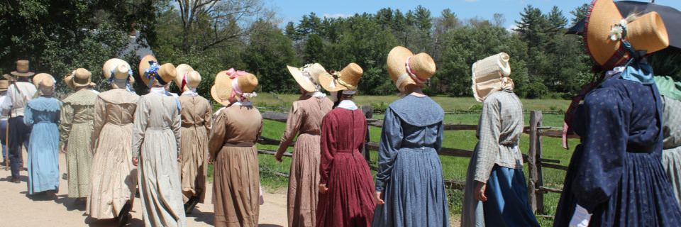 A group of historical interpreters in early 19th-century costume