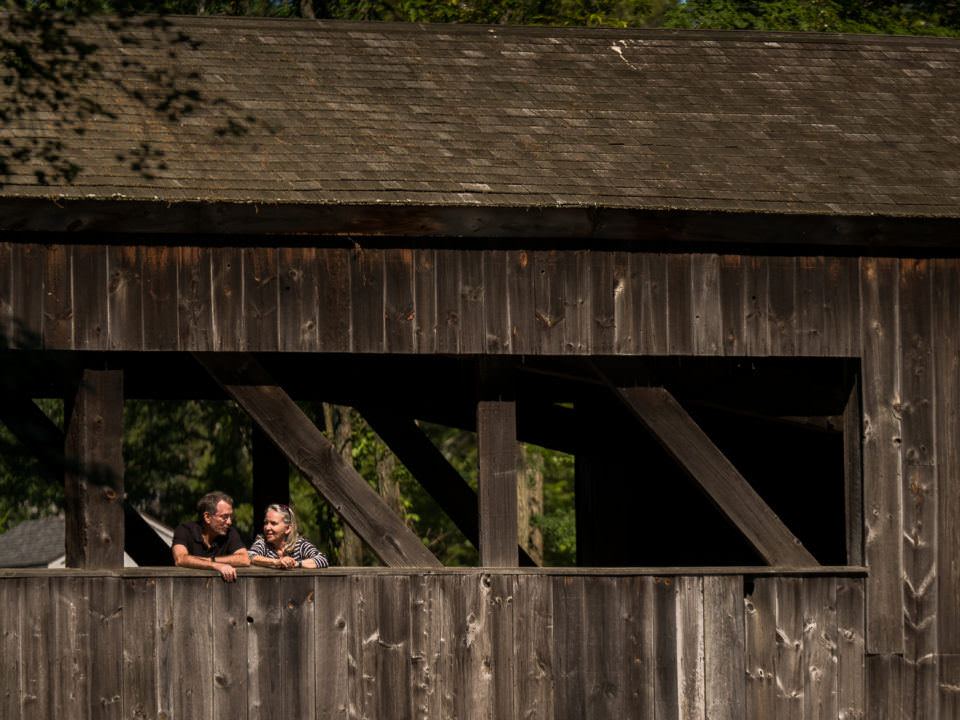 A couple visits the Quinebaug River Bridge